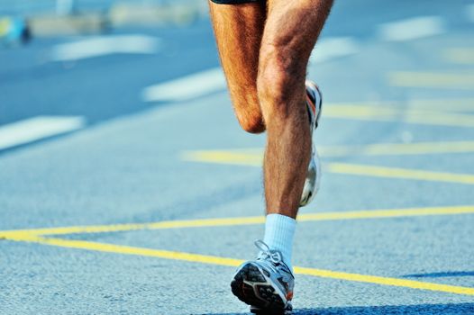 Dynamic run of marathoner on a finish line