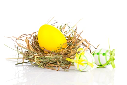 Easter Eggs in a nest on a white background