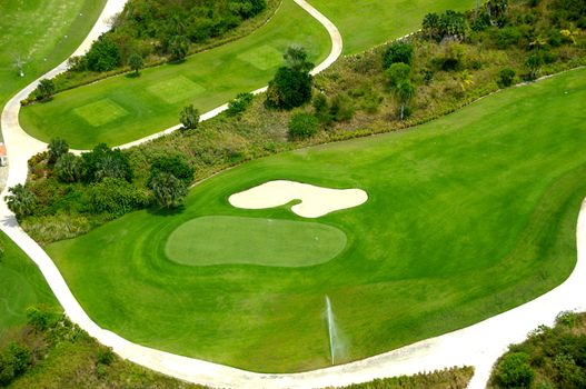 Flying above a golf course at an exotic destination