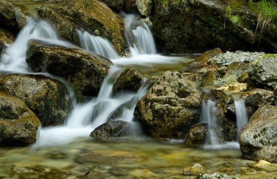 Nice detail of small cascade with mossy stones