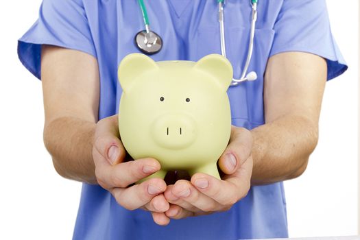 A doctor holding a piggy bank. Payment medicine.