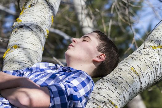 Dream.A young boy dressed in western attire, outdoor park, summer