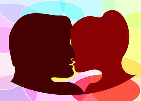 Silhouettes of a man and a woman's head kissing each other on a colorful background
