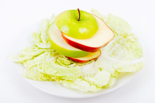 plate with salad and apples. vegetarian food