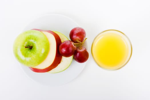 grapes, apples and orange juice. top view