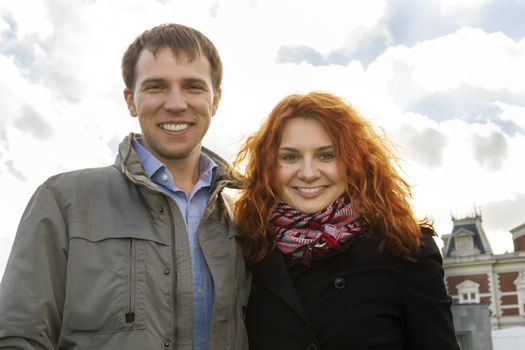 Outdoor happy couple in love, Museum Plein, autumn Amsterdam background