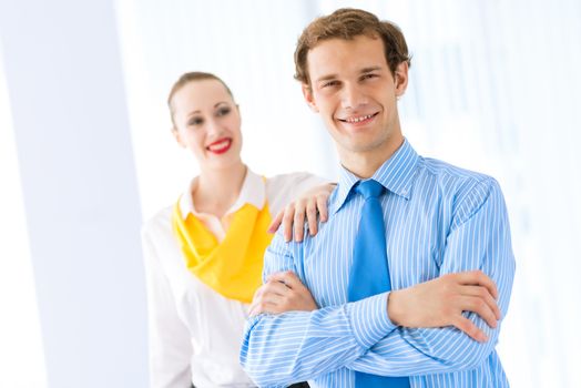 Businessman receiving congratulations from his colleagues in the leadership team work