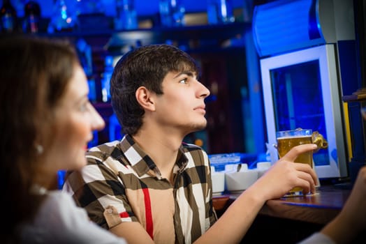 portrait of a young man at the bar, fun nightlife