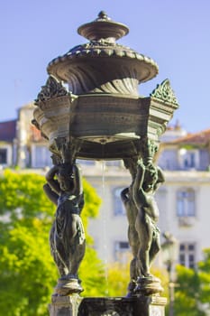 Rossio square statue fountain at Baixa district in Lisbon, Portugal