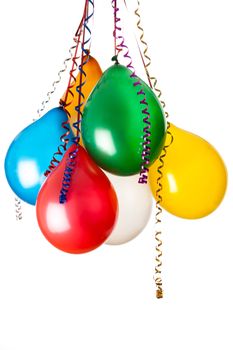 colored balloons isolated on white with hanging holiday streamers