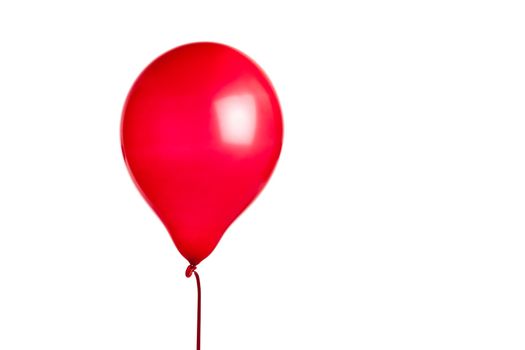 Red balloon isolated on white with red string