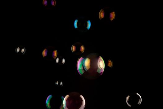 a bunch of color Soap bubbles on black background