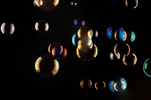 a bunch of color Soap bubbles on black background