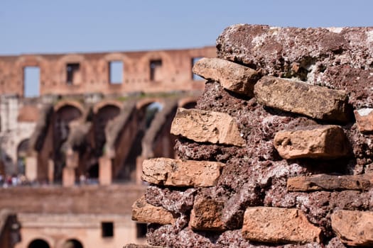 A Coloseum ruins and blue sky in Rome
