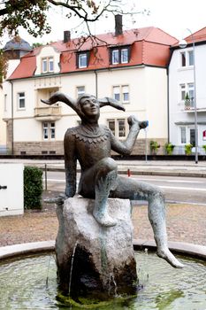 A sculpture harlequin in the fountain in Baden-Baden
