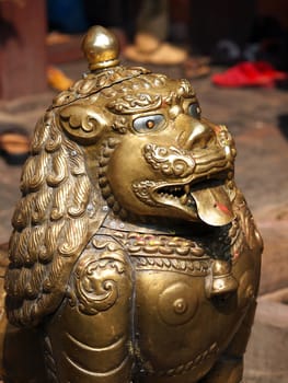 bronze lion guardian in buddhist temple         