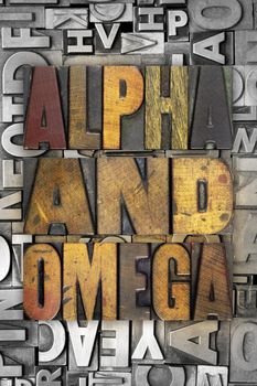 The words ALPHA AND OMEGA written in vintage letterpress type