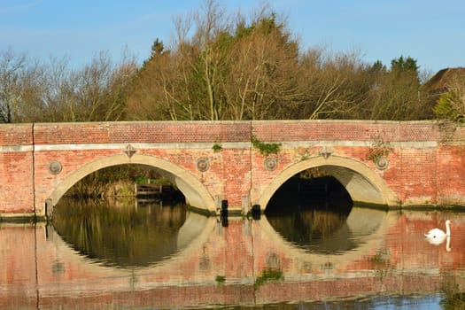 two arches of red brick bridge