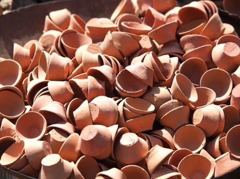 small clay pots on the sun of India       