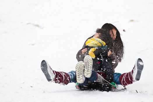 Girl sledging in winter in Denmark