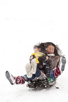 Girl sledging in winter in Denmark