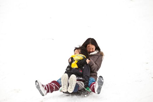 Girl sledging in winter in Denmark