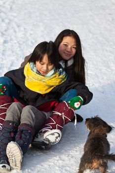 Girl sledging in winter in Denmark