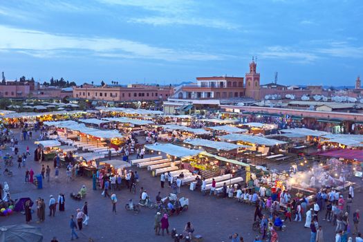 Djemaa el Fna market in Marrakesh, Morocco at sunset