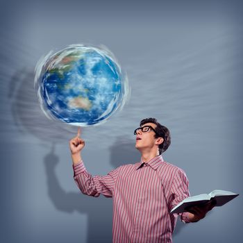 young man with a book thinks. keeps the finger symbol of the planet Earth. NASA images used