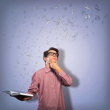 young scientist holding a book, fly out different ideas. concept of creativity