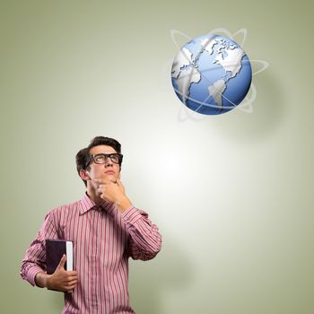 young man with a book thinks. it over symbol planet Earth