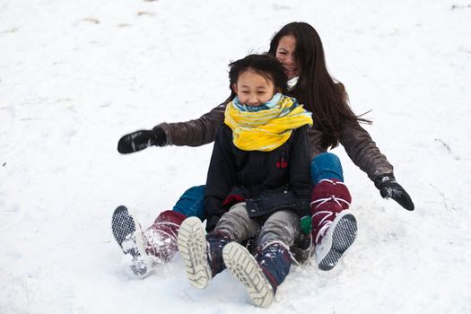 Girl sledging in winter in Denmark