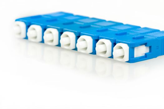 blue fiber optic SC connectors with reflection isolated on white background