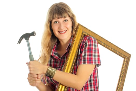 Young woman with frame and hammer on white background