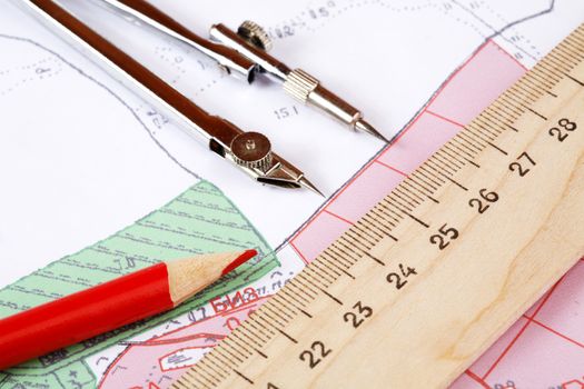 Topographic map and pencils close up