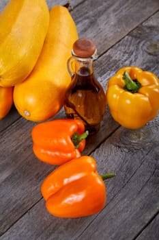 Still-life with vegetable marrows a paprika and olive oil