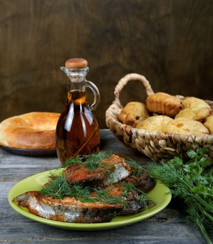Fried fish with greens and olive oil