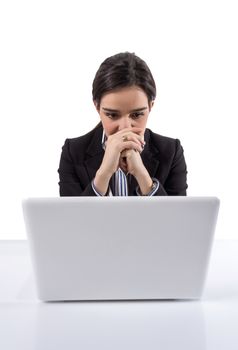 Portrait of stressed and tired young business woman with a laptop computer on white background