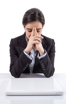 Portrait of stressed and tired young business woman with a laptop computer on white background