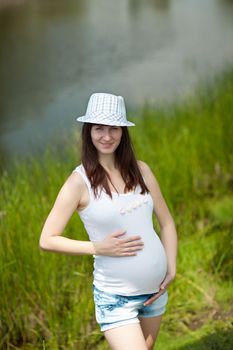 young fashion pregnant girl outdoors