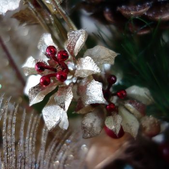 Christmas decoration with gold leaves and red berries