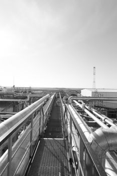 Industrial zone. Steel pipelines, valves and ladders