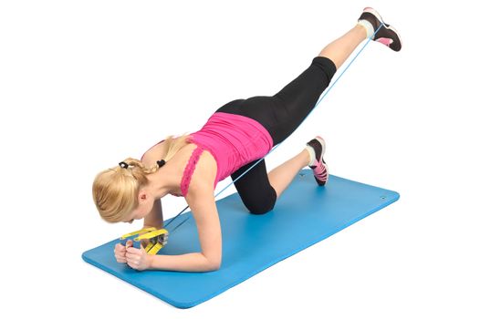 Young blond girl doing kneeling butt blaster exercise using rubber resistance band. position 2 of 2.