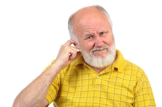bald senior man picking his ear with index finger