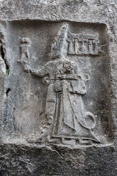 Rock carving in Yazilikaya depicting god Sharruma and King Tudhaliya dated to around 1250 - 1220 BC.