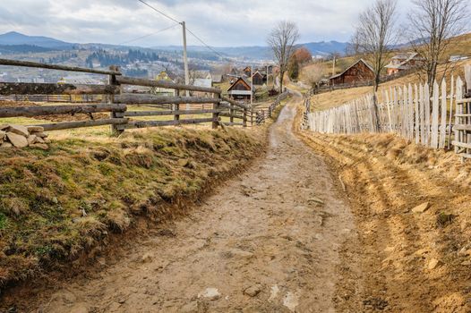 Dirty road in Carpathian village Vorokhta in the Ukraine