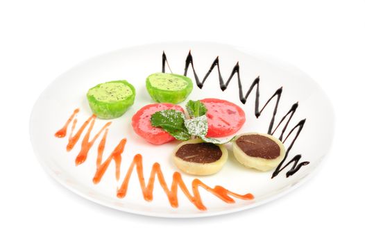 Japanese dessert Mochi served on plate with mint leaves