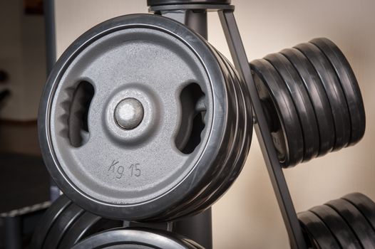 Barbell plates holder rack in the gym