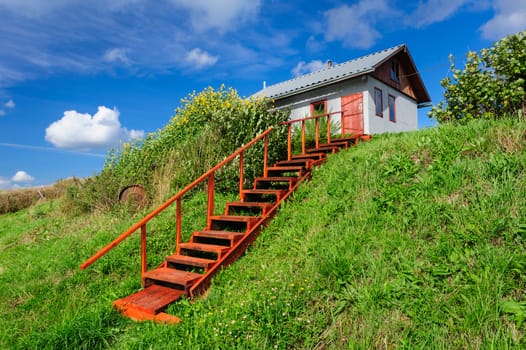 Small house with stairs, in the Kindasovo village, Karelia, north of Russia