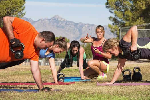 Female fitness instructor counting for exercise class